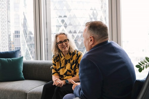 Whistleblowing - Image of colleagues sitting and discussing